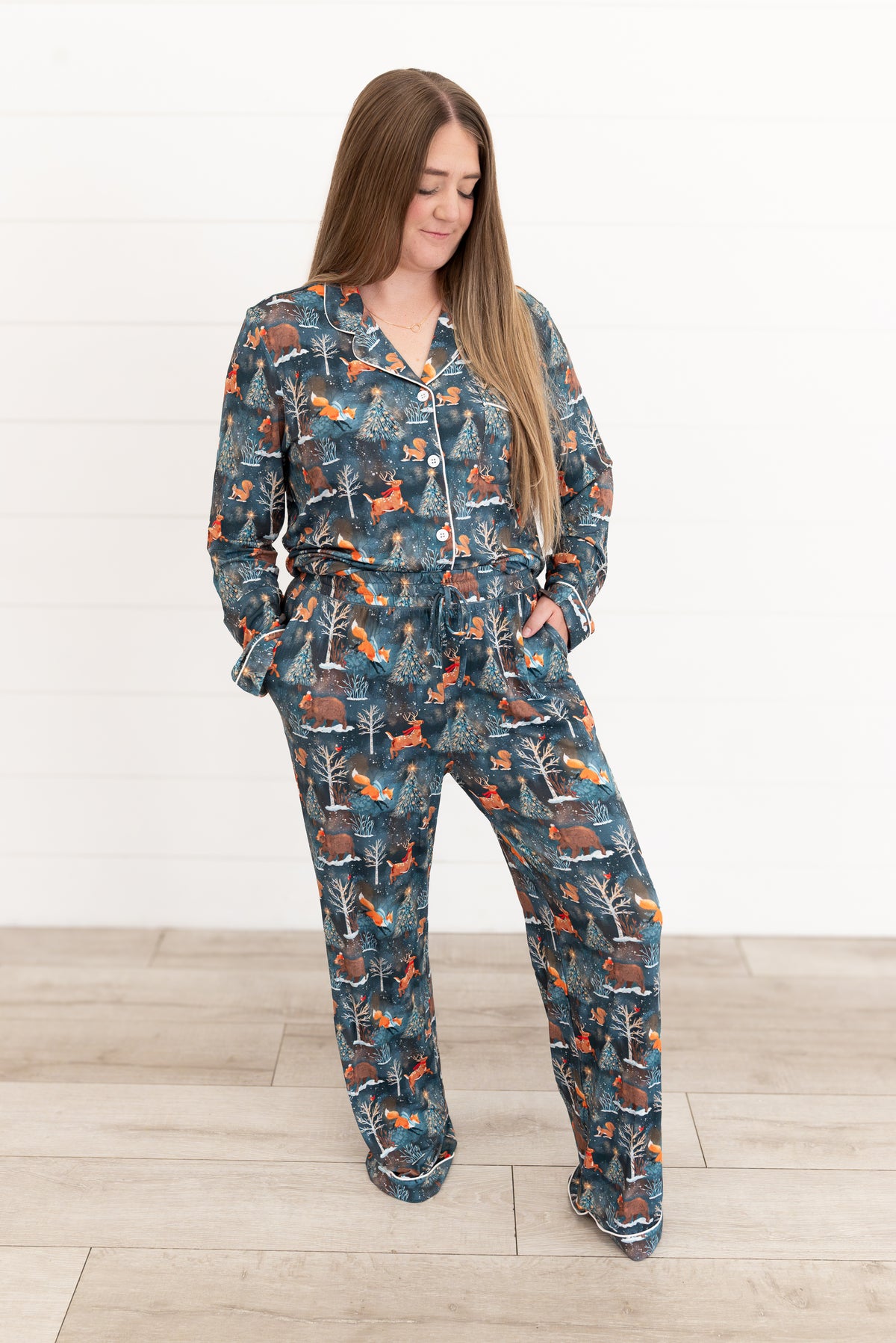 Woman standing with hands in pockets wearing Woodland Wonder bamboo women's pajama pants