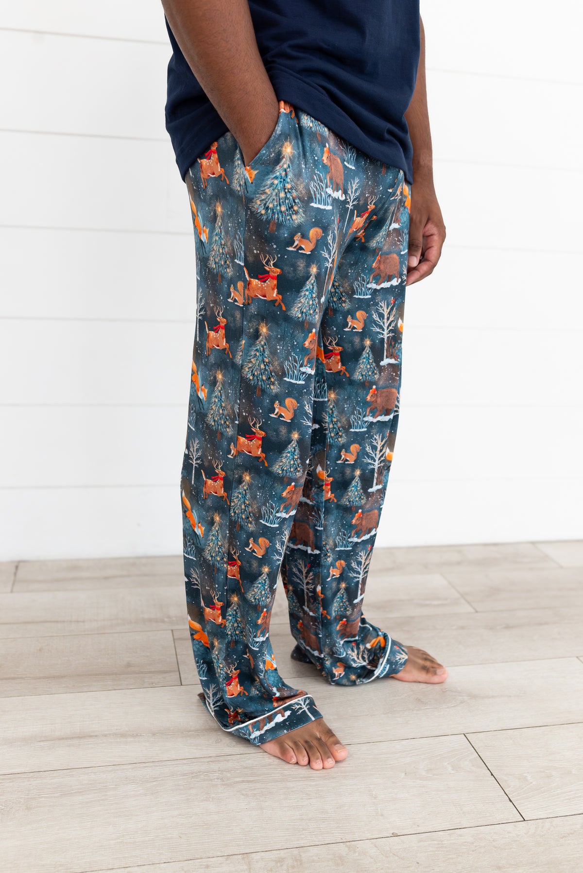 Close-up of Woodland Wonder bamboo men's pajama pants showing the Christmas woodland print and fit