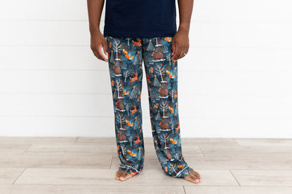 Man standing in a navy t-shirt and Woodland Wonder bamboo men's pajama pants