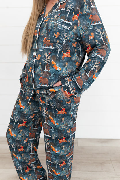 Close-up of the Woodland Wonder bamboo women's button-front shirt showing white piping and woodland animal print