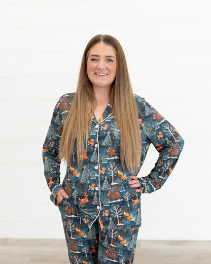 Woman smiling at the camera wearing the Woodland Wonder bamboo women's button-front pajama shirt