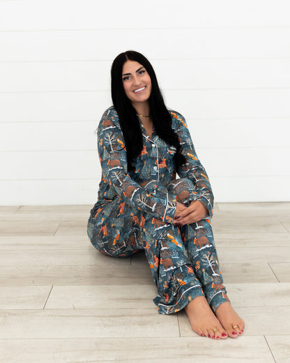Woman sitting on the floor with legs crossed wearing Woodland Wonder bamboo women's pajama pants