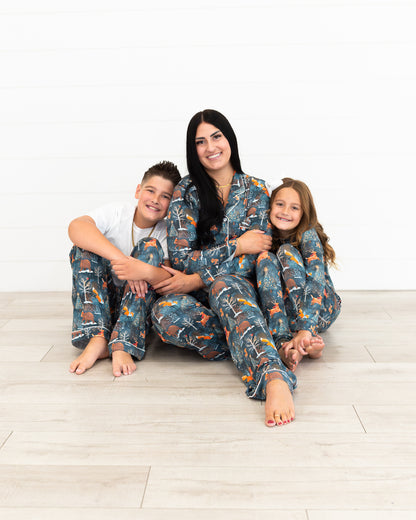 Mom with two kids wearing matching Woodland Wonder bamboo Christmas pajamas
