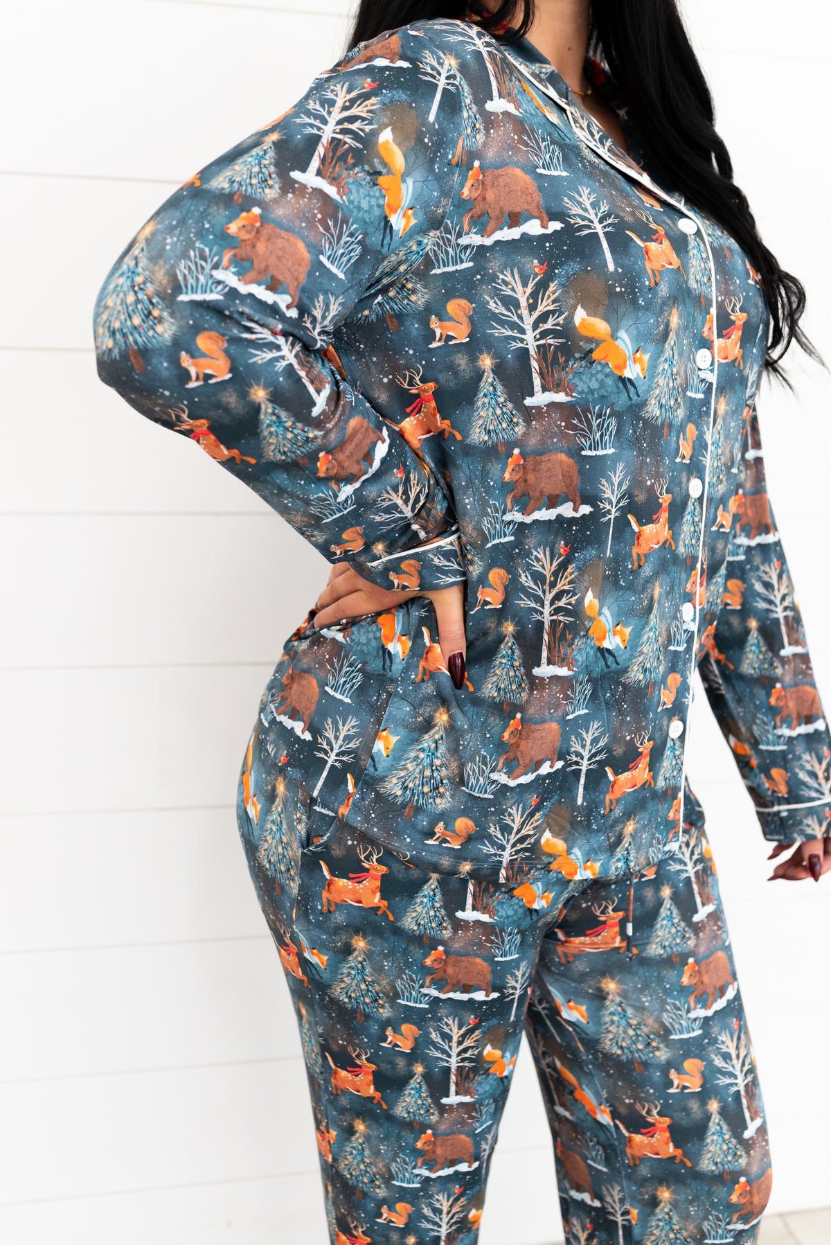 Side view of a woman wearing the Woodland Wonder bamboo women's pajama shirt and pants