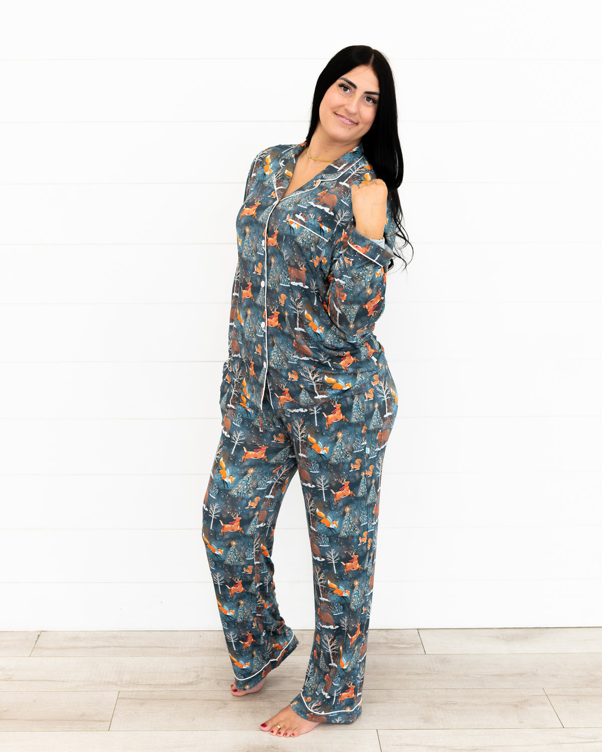 Woman standing and smiling wearing Woodland Wonder bamboo women's pajama pants