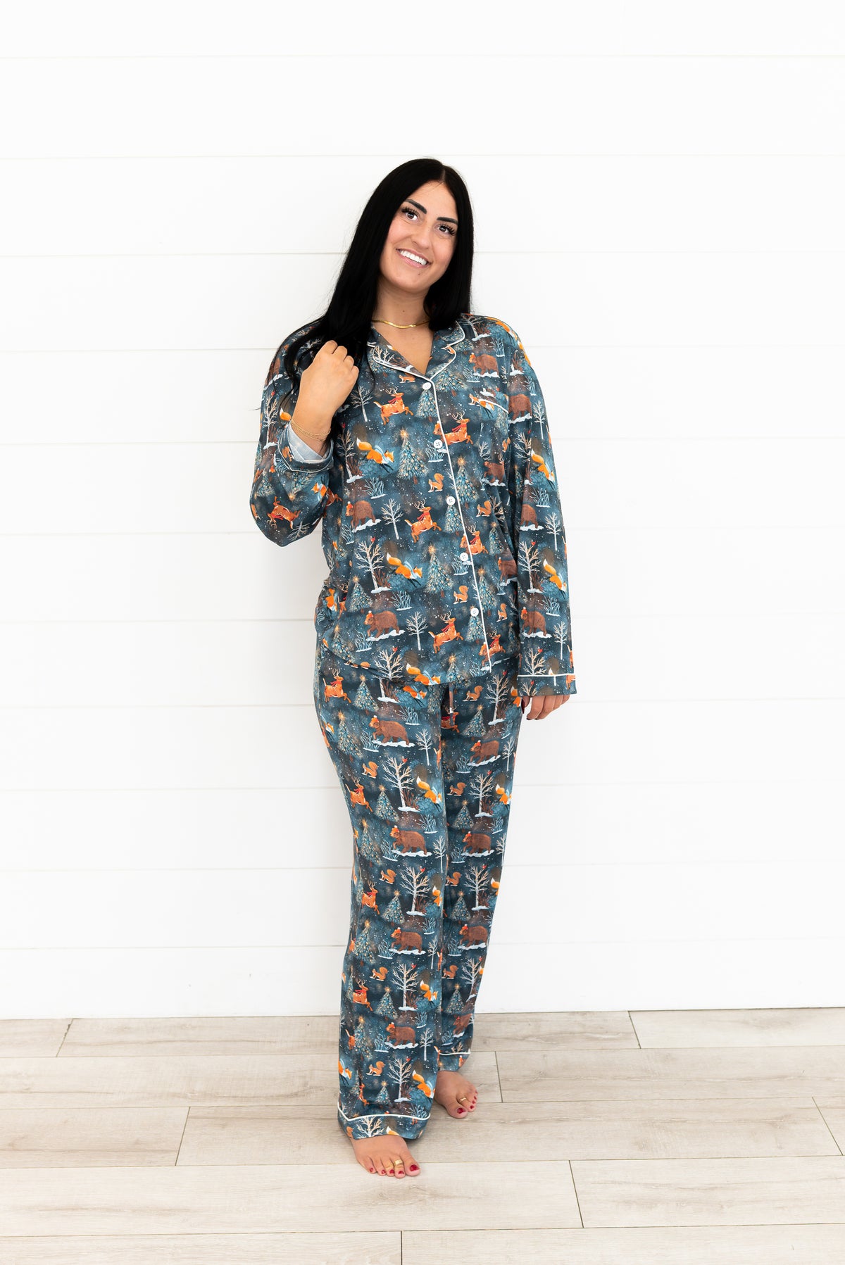 Woman standing in the Woodland Wonder bamboo women's pajama set, button-front shirt and pants