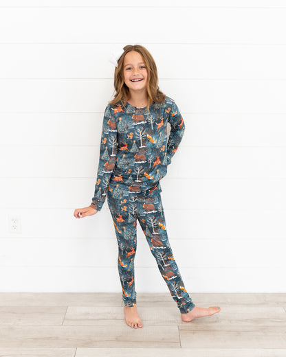 Teen girl standing in Woodland Wonder bamboo teen two-piece pajamas