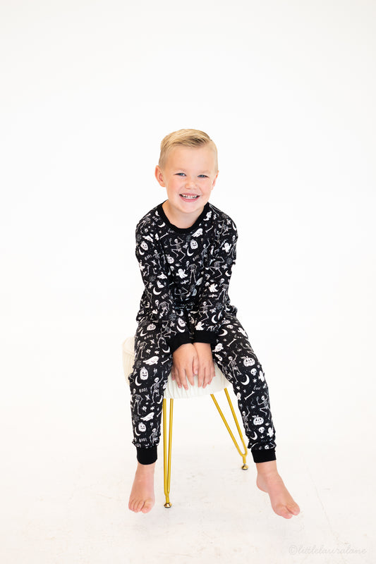 Skeleton Party Black & White Halloween Bamboo Jogger Set – on-model, boy wearing black skeleton-print bamboo jogger set