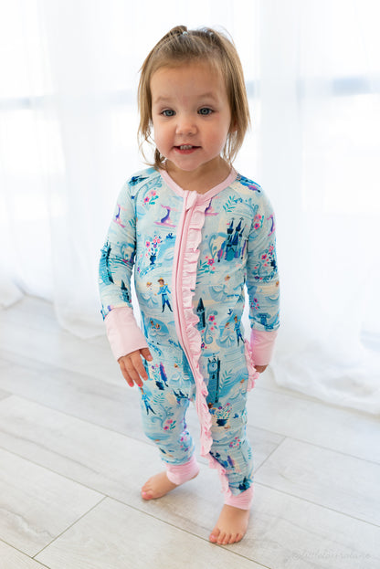 Baby Princess Pajama – The Wish Collection – on-model front view, toddler in blue castle-print zip pajama