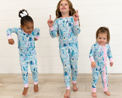 Two Piece Princess Pajama – The Wish Collection – on-model, three girls dancing in matching blue castle-print pajamas