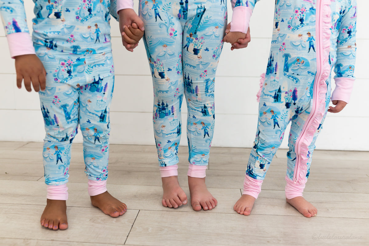 Two Piece Princess Pajama – The Wish Collection – on-model close-up, three children in matching blue castle-print pajamas