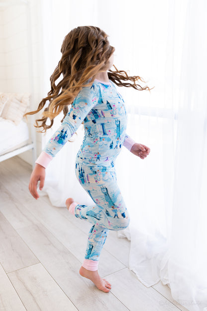 Two Piece Princess Pajama – The Wish Collection – on-model lifestyle, girl running in blue castle-print pajamas