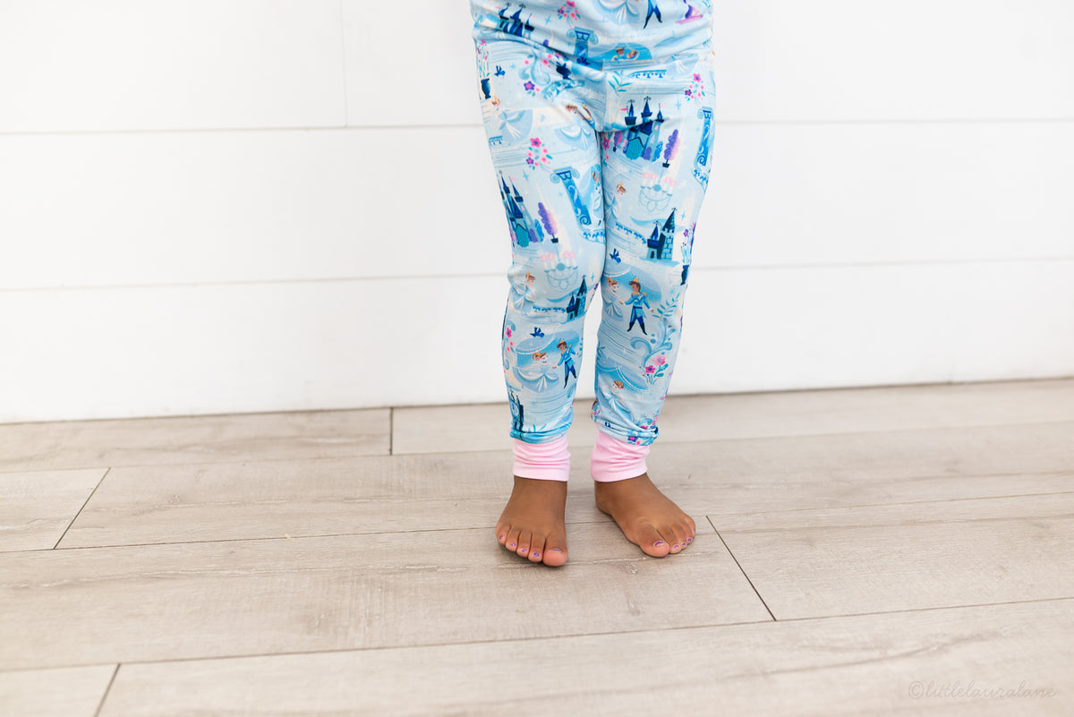 Two Piece Princess Pajama – The Wish Collection – on-model close-up of blue castle-print pajama pants