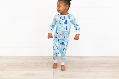 Two Piece Princess Pajama – The Wish Collection – on-model full-length front view, toddler in blue castle-print pajamas