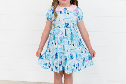 Girls Princess Dress with Shorts – The Wish Collection – close-up on-model of blue castle and glass-slipper print dress
