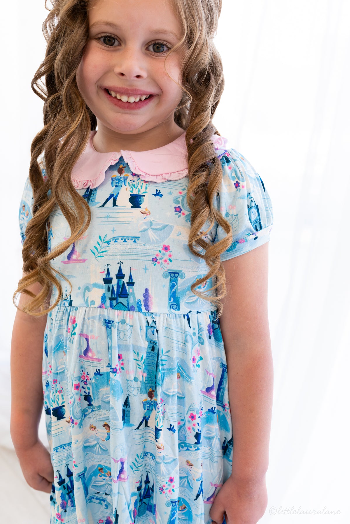 Girls Princess Dress with Shorts – The Wish Collection – close-up on-model, blue castle and glass-slipper print dress
