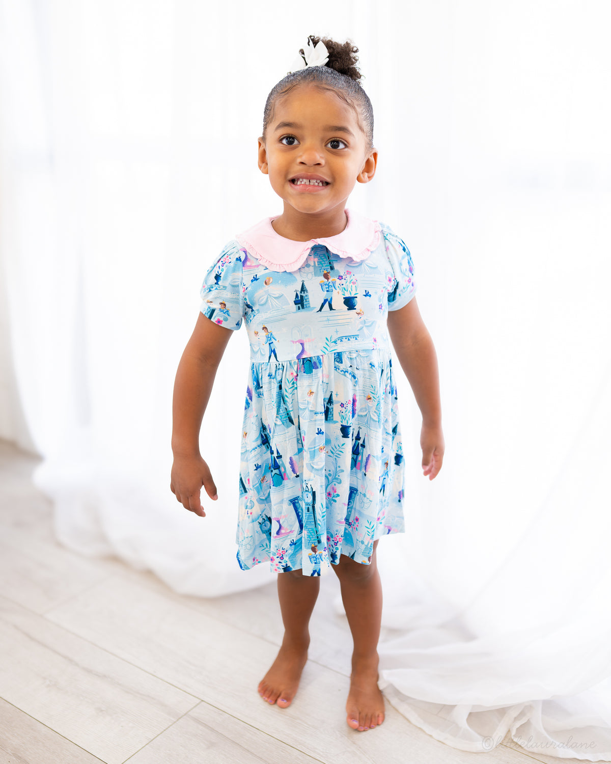 Girls Princess Dress with Shorts – The Wish Collection – on-model front view, toddler in blue castle-print dress