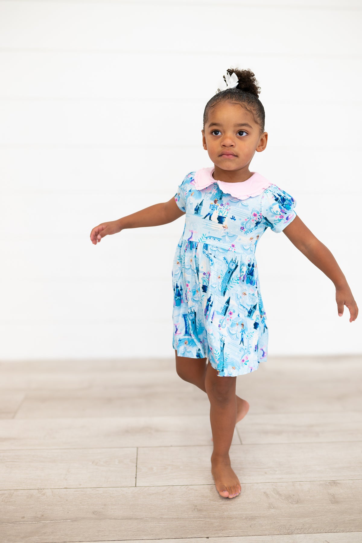 Girls Princess Dress with Shorts – The Wish Collection – on-model front view, toddler in blue castle-print dress