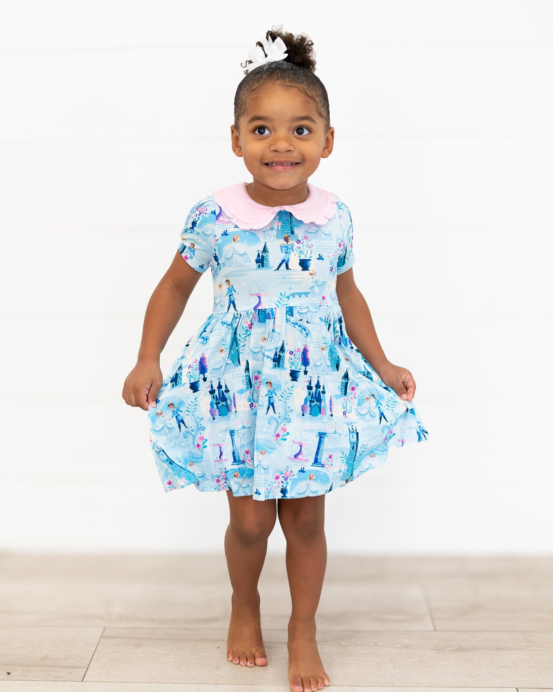 Girls Princess Dress with Shorts – The Wish Collection – on-model front view, blue castle and glass-slipper print