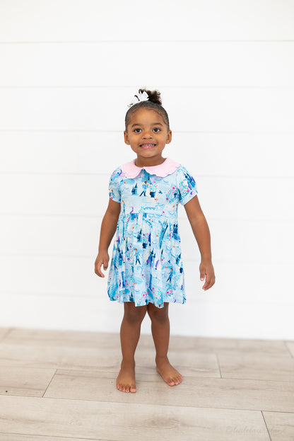 Girls Princess Dress with Shorts – The Wish Collection – on-model full-length front view, blue castle-print dress