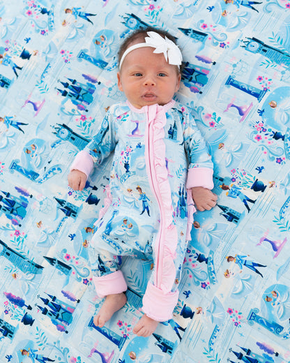 Baby Princess Pajama – The Wish Collection – on-model, baby on blue castle-print blanket in blue castle-print zip pajama