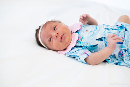 Baby Princess Dress – The Wish Collection – on-model, newborn in blue castle-print dress with pink ruffled collar